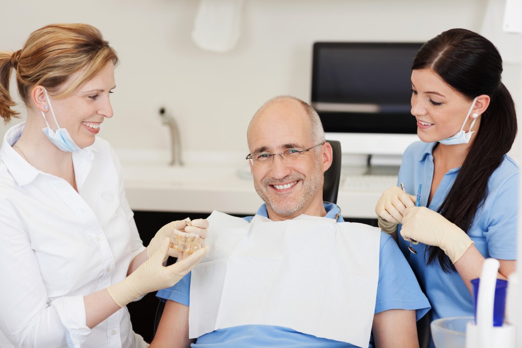 Dentist explaining implants to patient